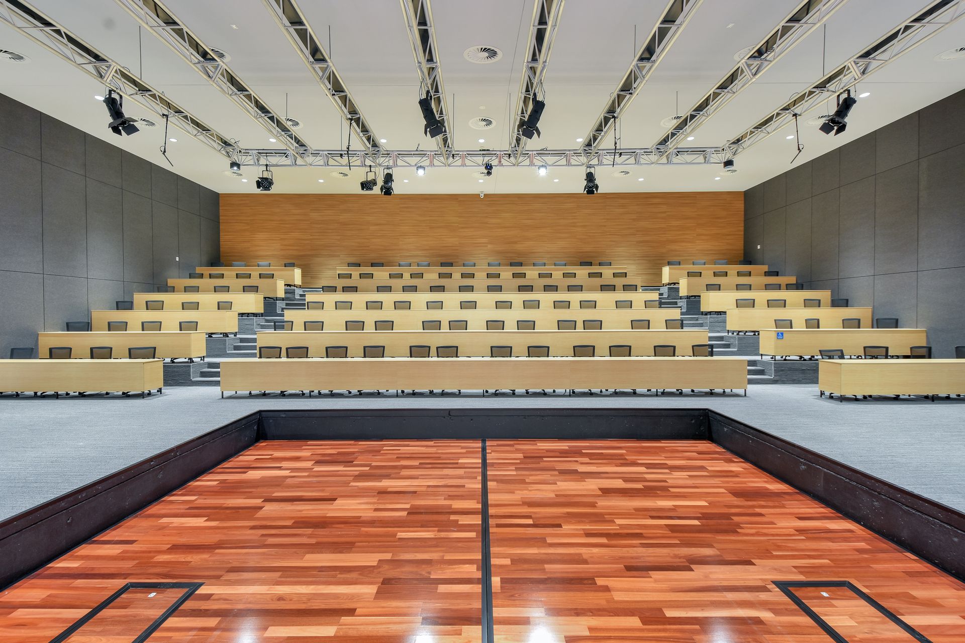 A large empty auditorium with a wooden floor