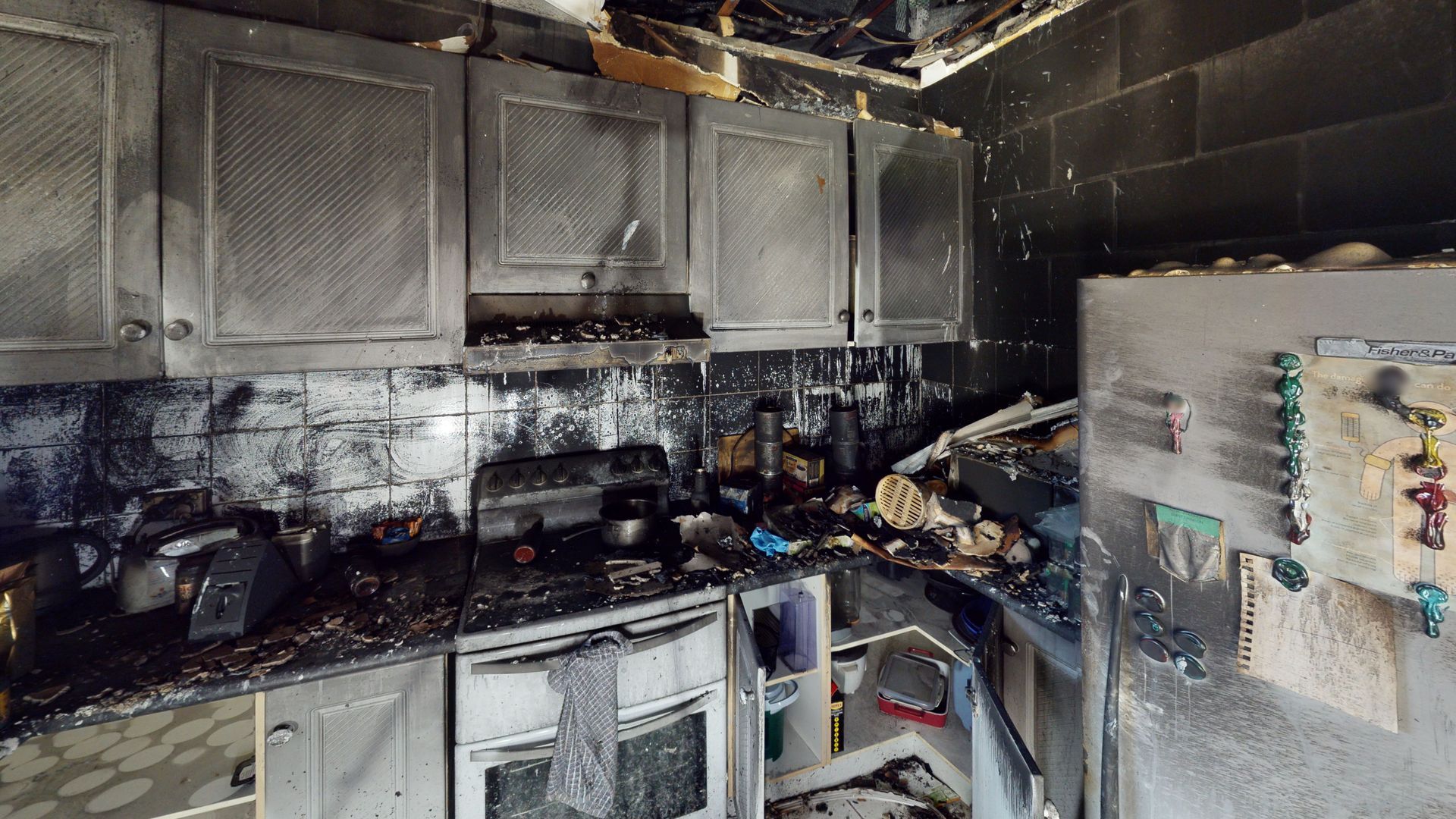 A kitchen that has been damaged by a fire.