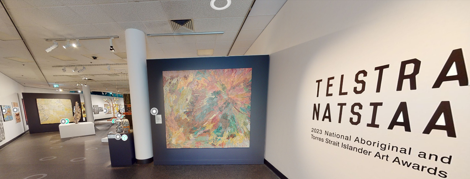 A large room with a sign that says telstra natsiaa