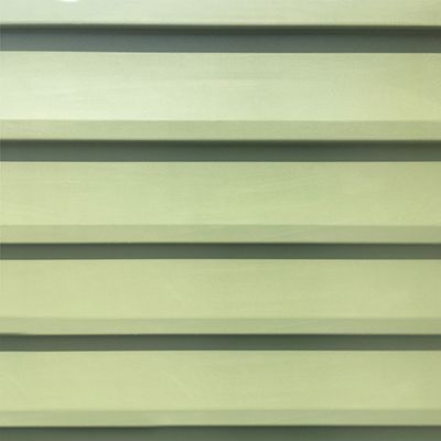 Horizontal rows of light yellow siding with gray shadows in between.