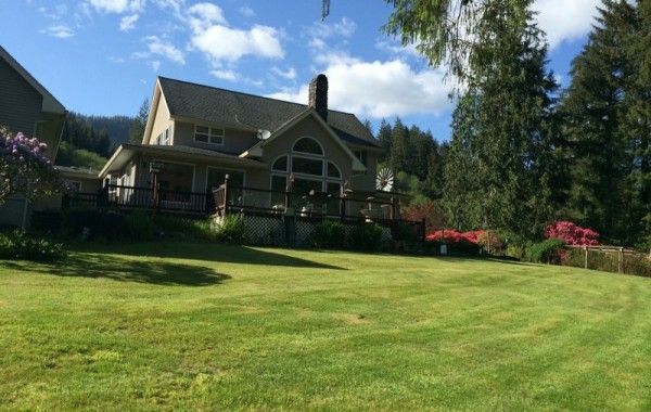 a large house with a large lawn in front of it