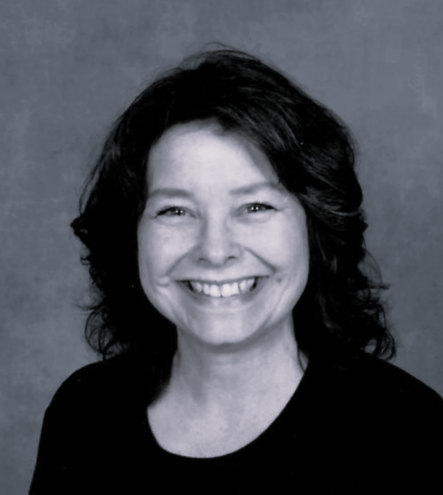 A black and white photo of a smiling woman in a circle