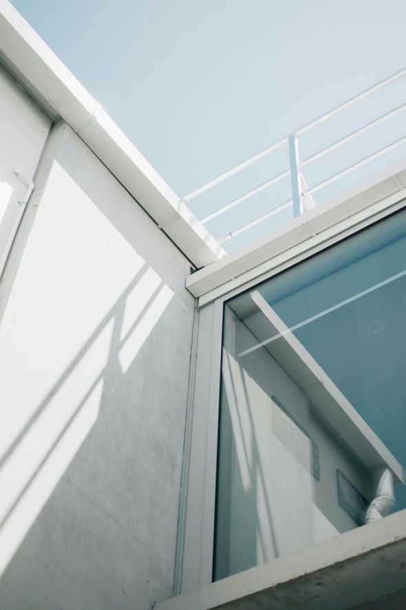 Looking up at a building with a blue sky in the background