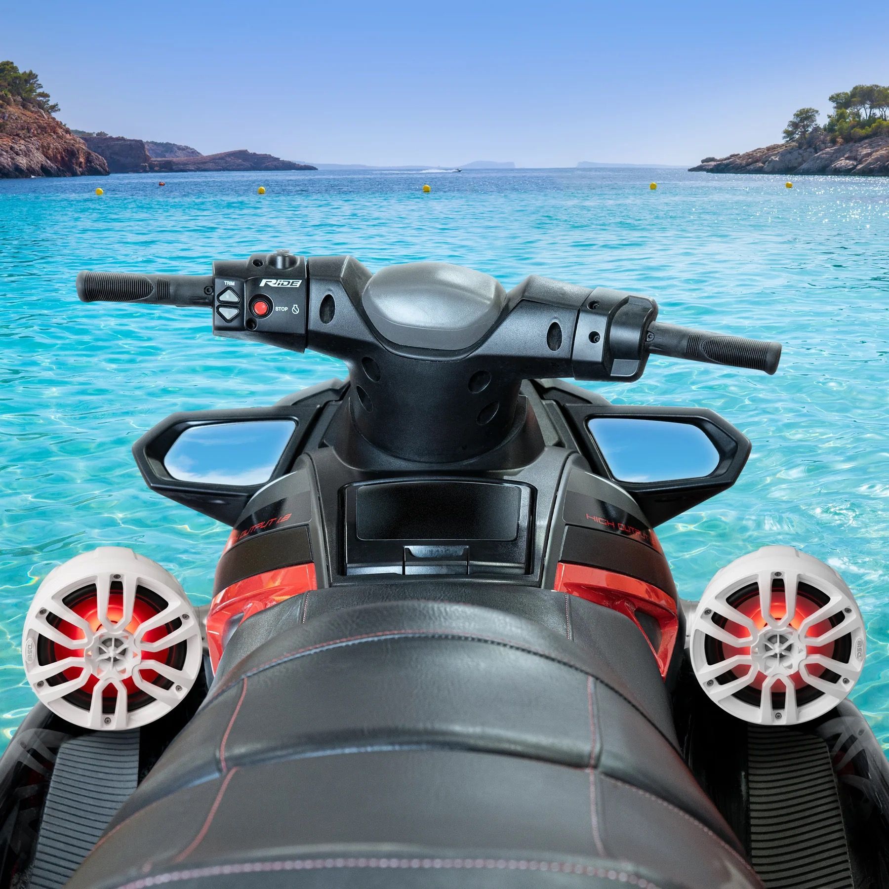 Jet ski with white speakers, in front of a turquoise ocean with islands in the background.