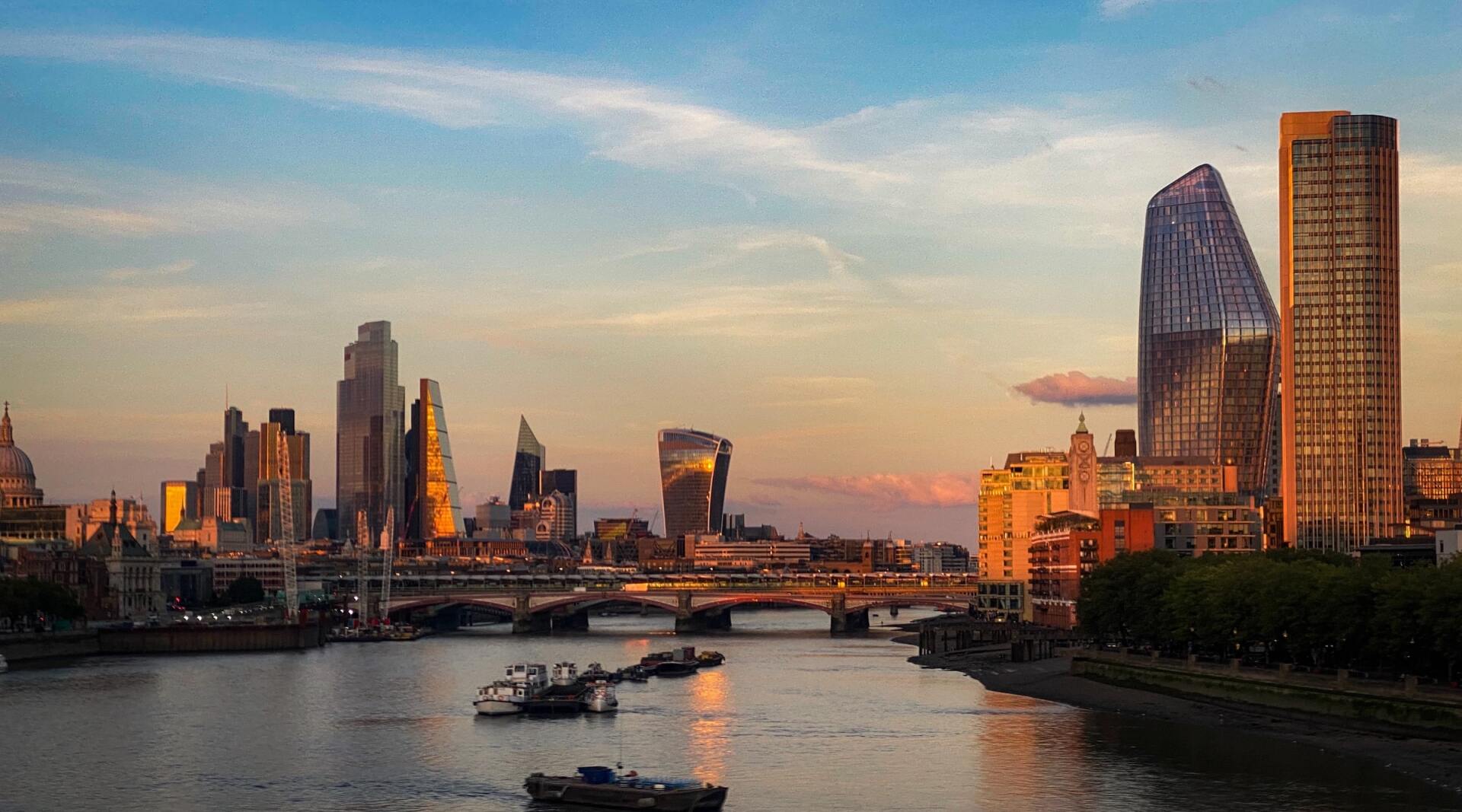 City scape of London across The Thames while the sun rises