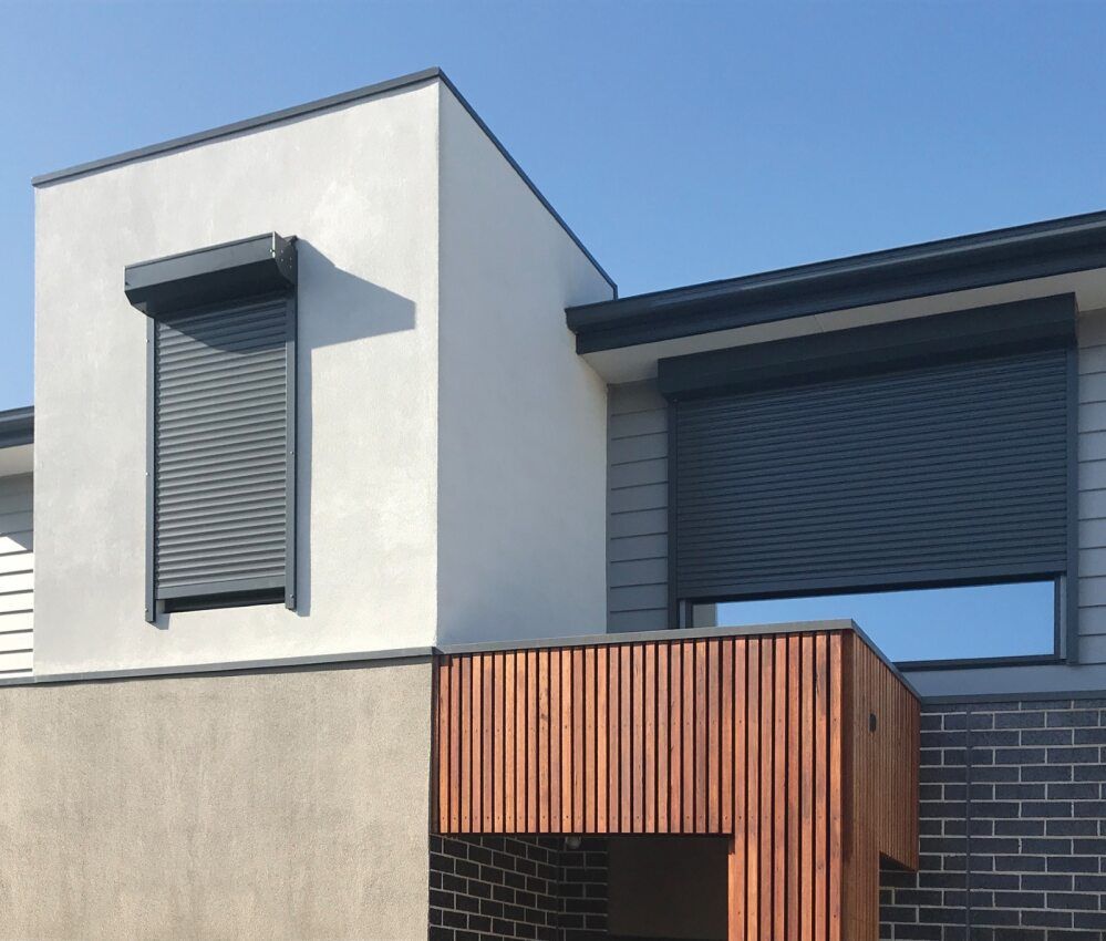 A White House With A Black Shutter On The Windows — Mid Coast Flooring & Blinds In Taree, NSW