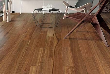 A Wooden Floor Is Being Installed On A Concrete Floor — Mid Coast Flooring & Blinds In Wingham, NSW
