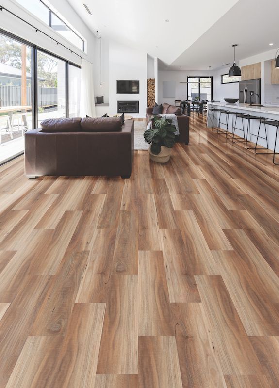 A Living Room With Hardwood Floors And A Couch — Mid Coast Flooring & Blinds In Old Bar, NSW