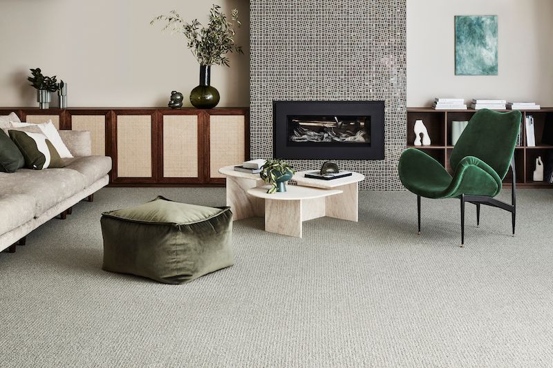 A Living Room with A Couch, Chair, Coffee Table and Fireplace — Mid Coast Flooring & Blinds In Taree, NSW