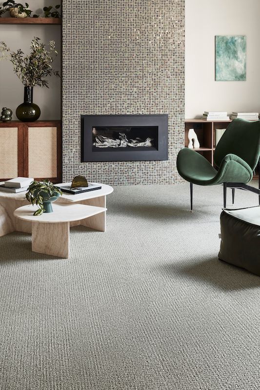 A Living Room With Two Coffee Tables And A Fireplace — Mid Coast Flooring & Blinds In Taree, NSW