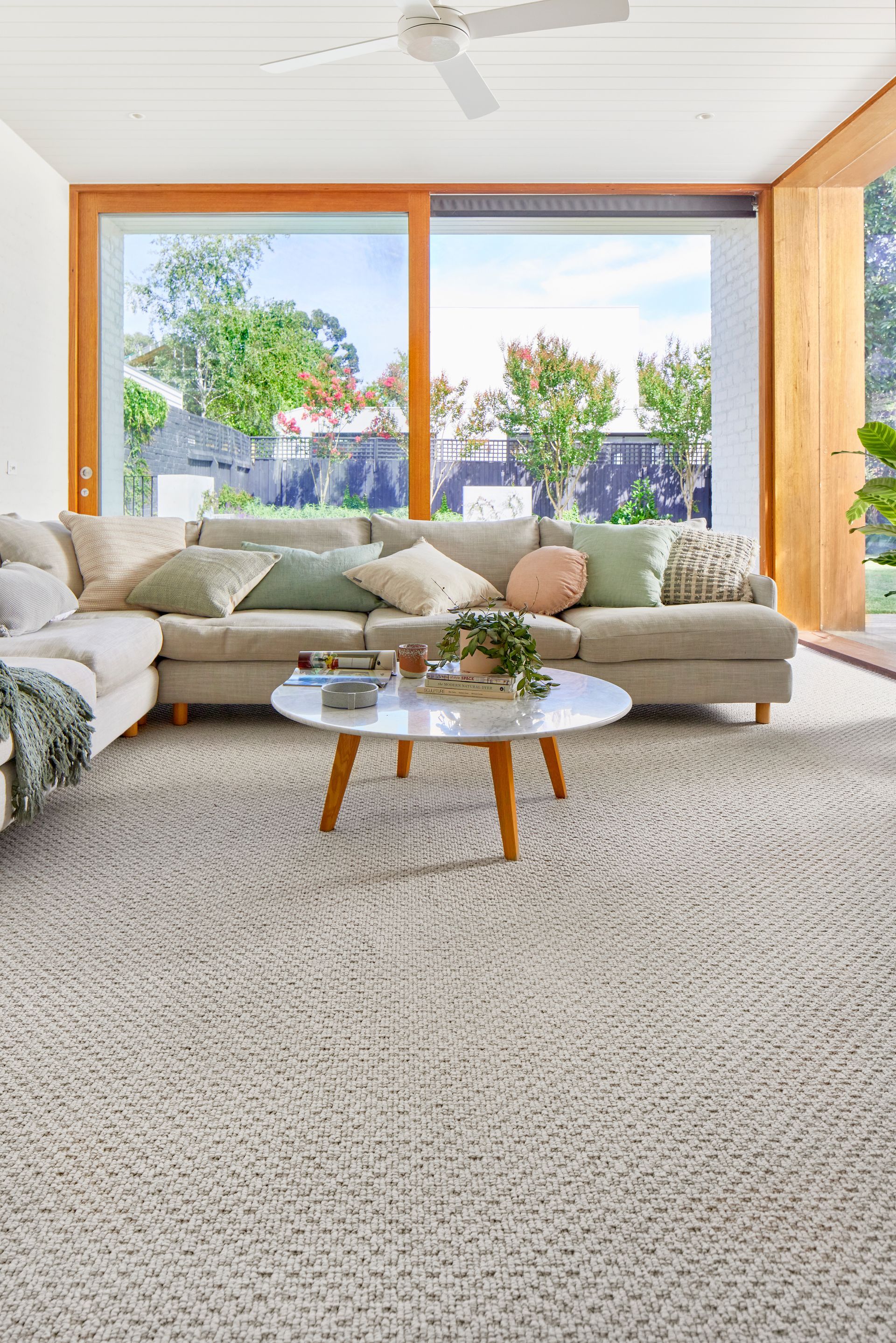A Living Room With A Couch — Mid Coast Flooring & Blinds In Old Bar, NSW