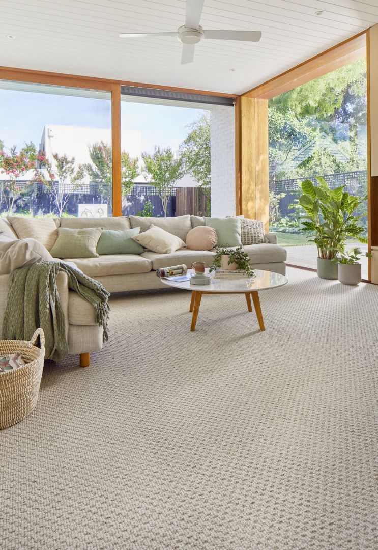 A Kitchen With White Cabinets And A Stainless Steel Refrigerator — Mid Coast Flooring & Blinds In Forster, NSW