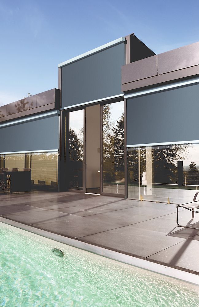 A House With A Swimming Pool In Front Of It — Mid Coast Flooring & Blinds In Wingham, NSW