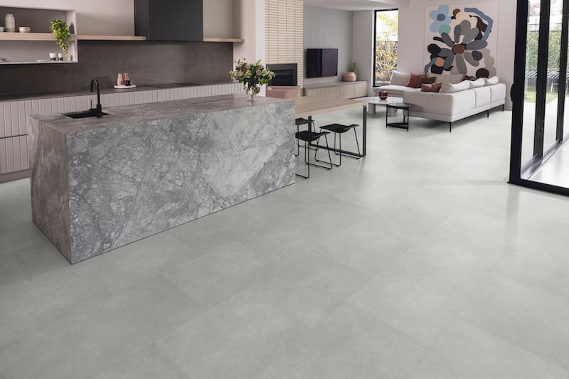 A Kitchen With A Large Island In The Middle Of The Room — Mid Coast Flooring & Blinds In Taree, NSW