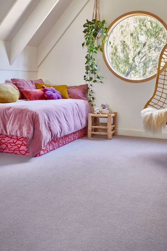 A Bedroom With A Bed — Mid Coast Flooring & Blinds In Laurieton, NSW