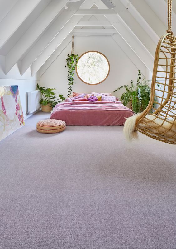 A Bedroom With A Bed And A Swing In The Attic — Mid Coast Flooring & Blinds In Taree, NSW