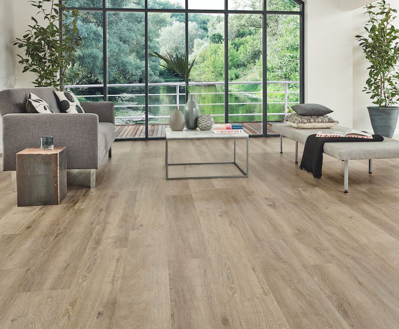 A Living Room With A Couch And A Coffee Table — Mid Coast Flooring & Blinds In Wingham, NSW