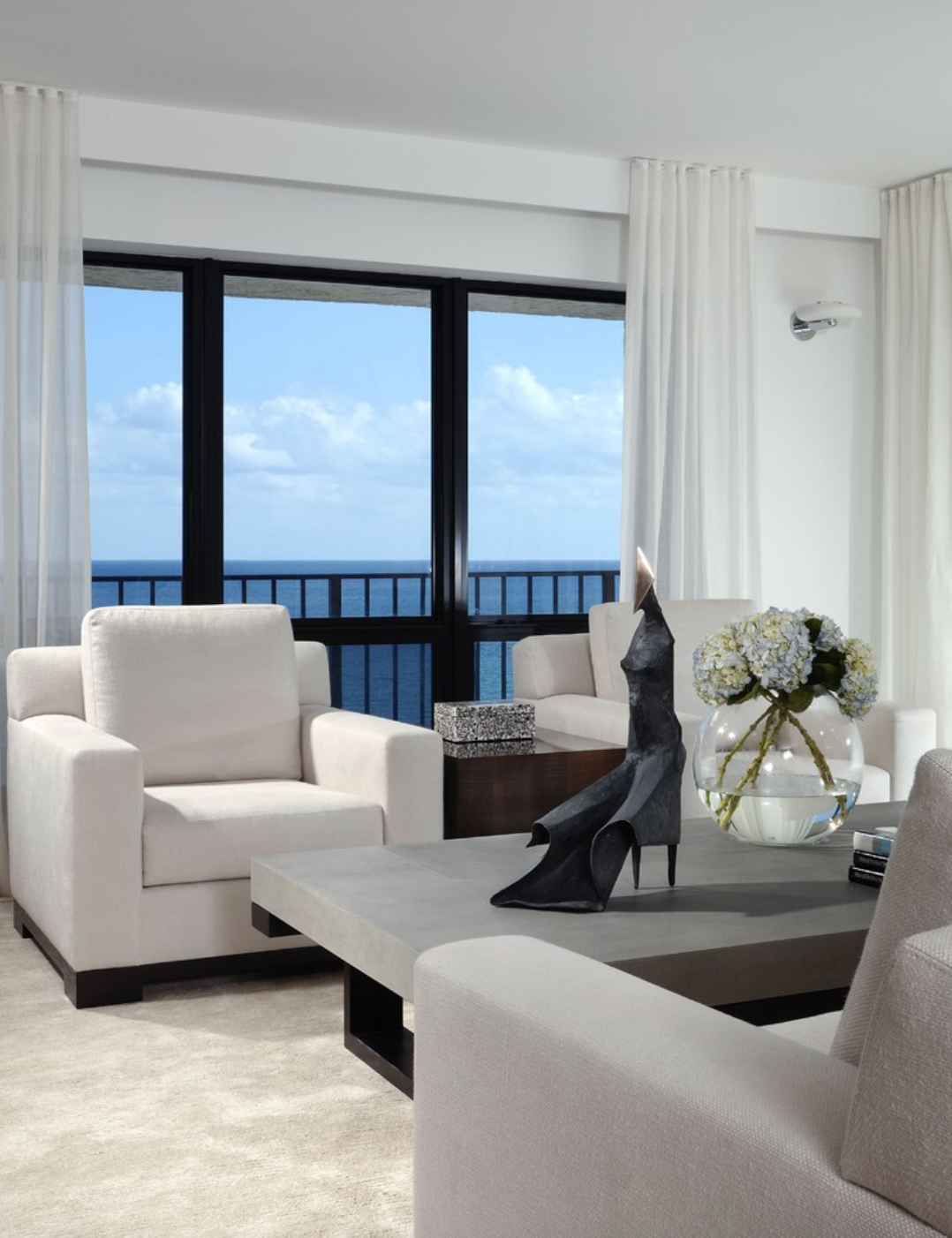 There Is A Large Window In The Bedroom With A View Of The City — Mid Coast Flooring & Blinds In Laurieton, NSW