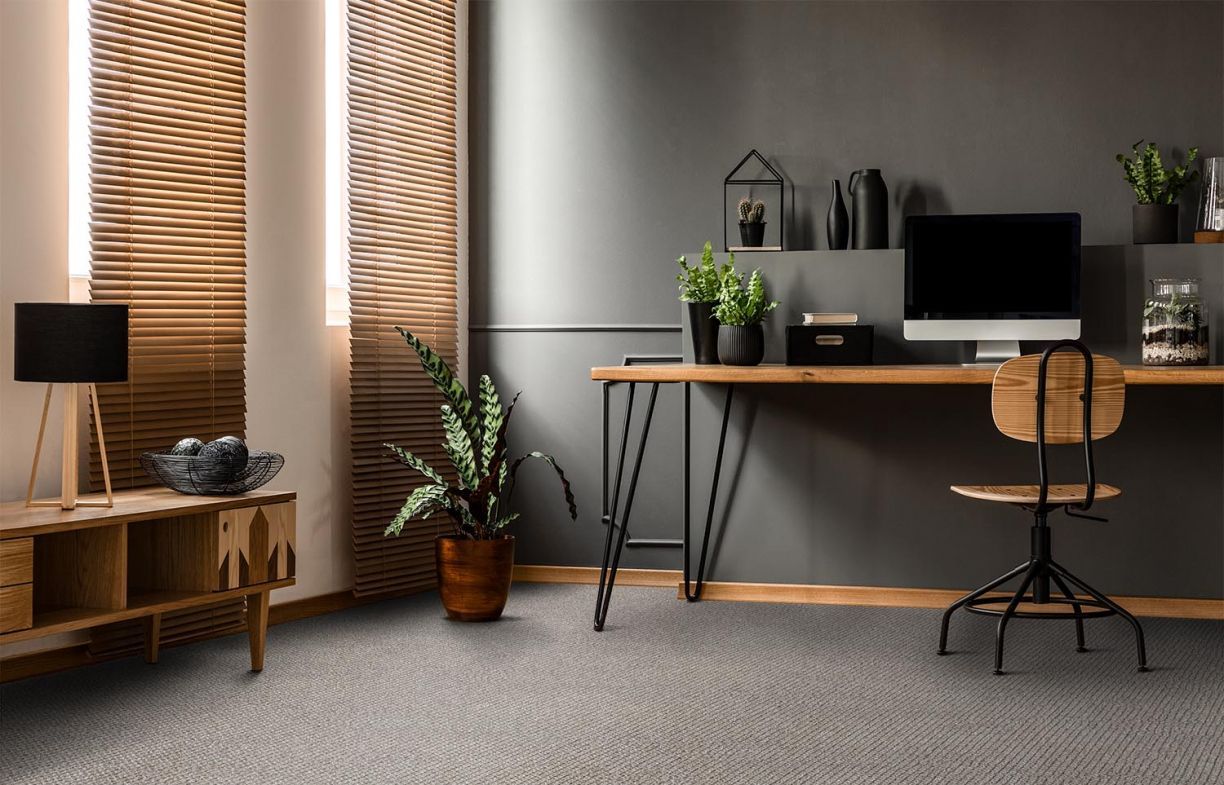 A Living Room With A White Couch And A Brown Rug — Mid Coast Flooring & Blinds In Old Bar, NSW