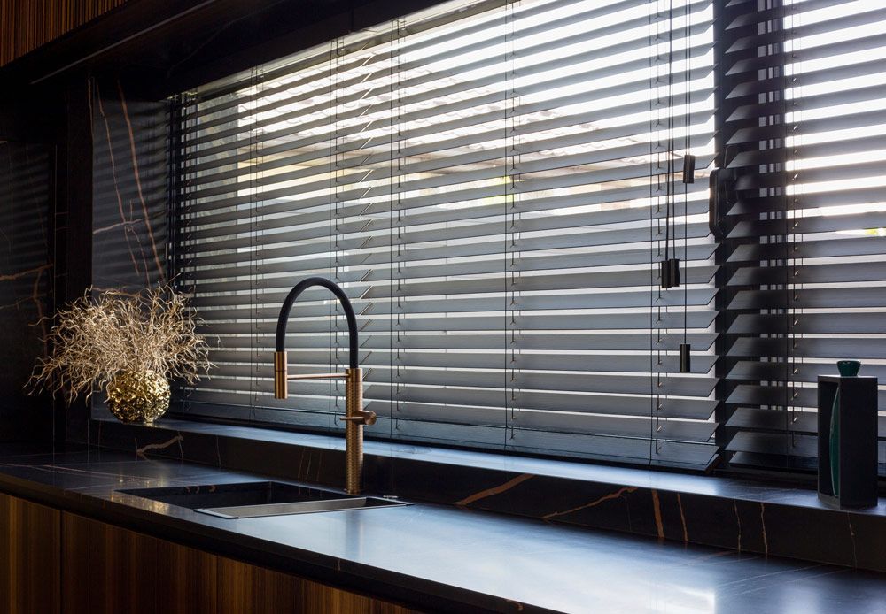 A Kitchen with A Sink and A Window with Blinds — Mid Coast Flooring & Blinds In Wingham, NSW