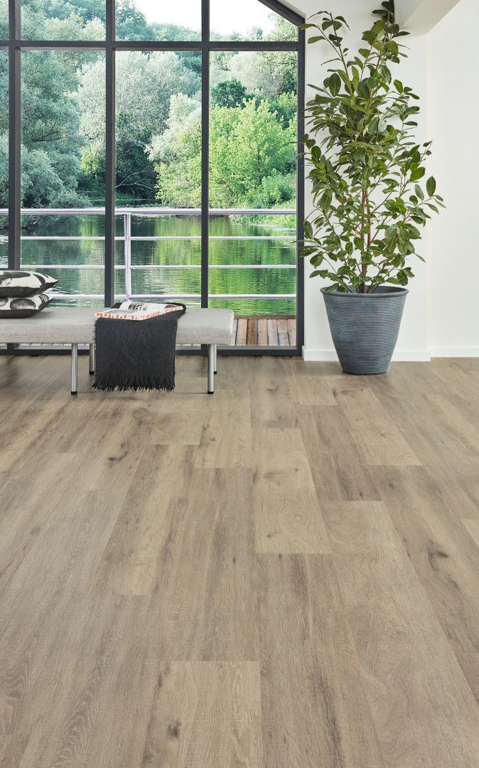 There Is A Bed In The Middle Of The Room With A Drawer Underneath It — Mid Coast Flooring & Blinds In Forster, NSW