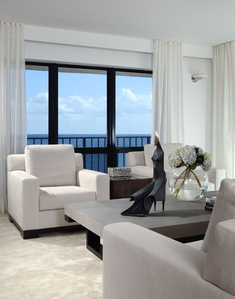 A Living Room With White Furniture And A View Of The Ocean — Mid Coast Flooring & Blinds In Old Bar, NSW