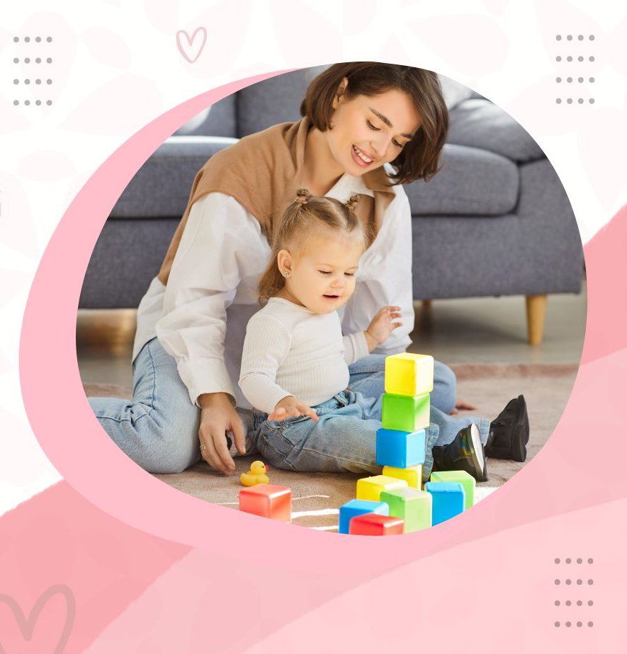 Woman and child playing with blocks on the floor; smiling and focused.
