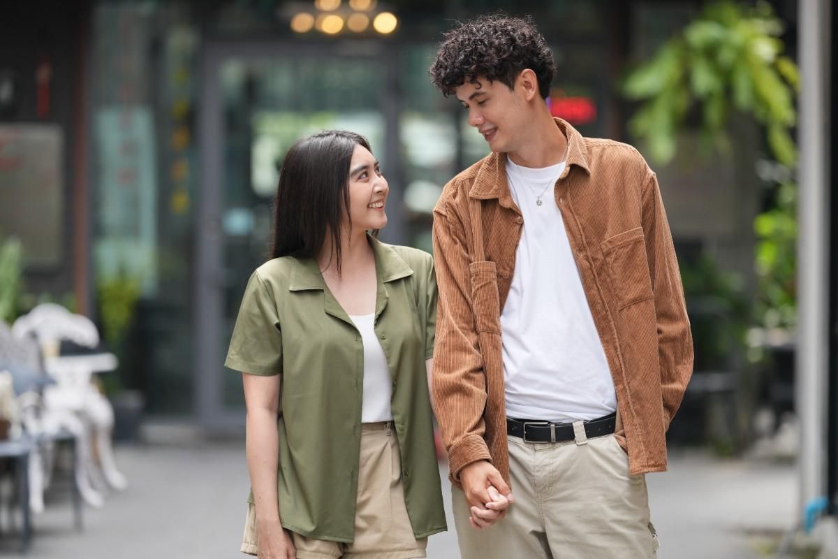 couple holding each other hands and looking to each other