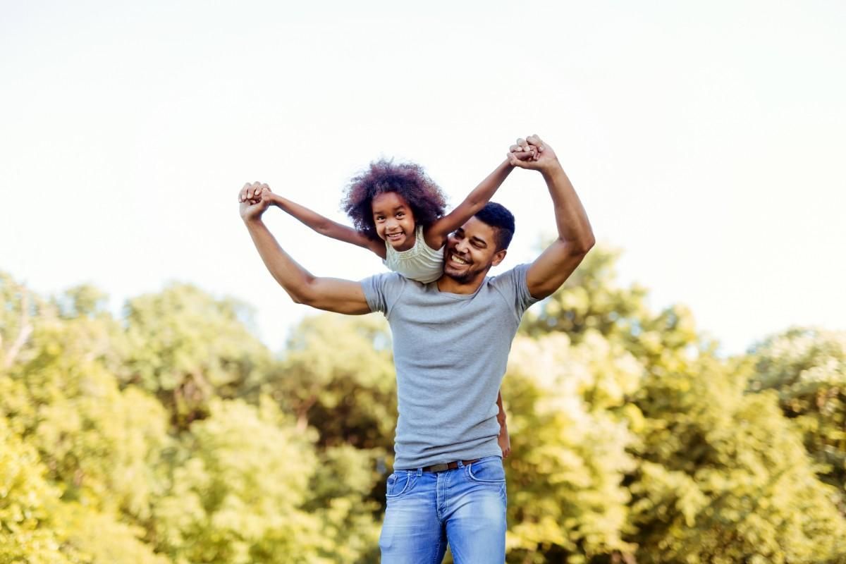 father playing  with his daughter