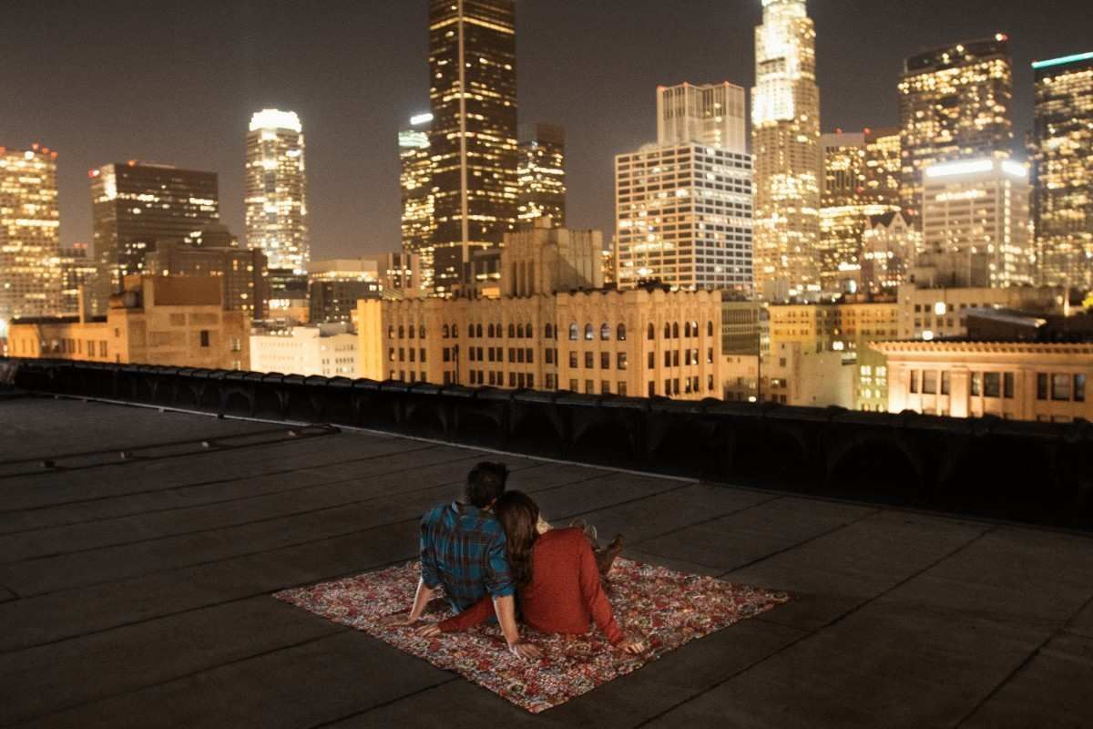 couple sitting and watching the cityscape