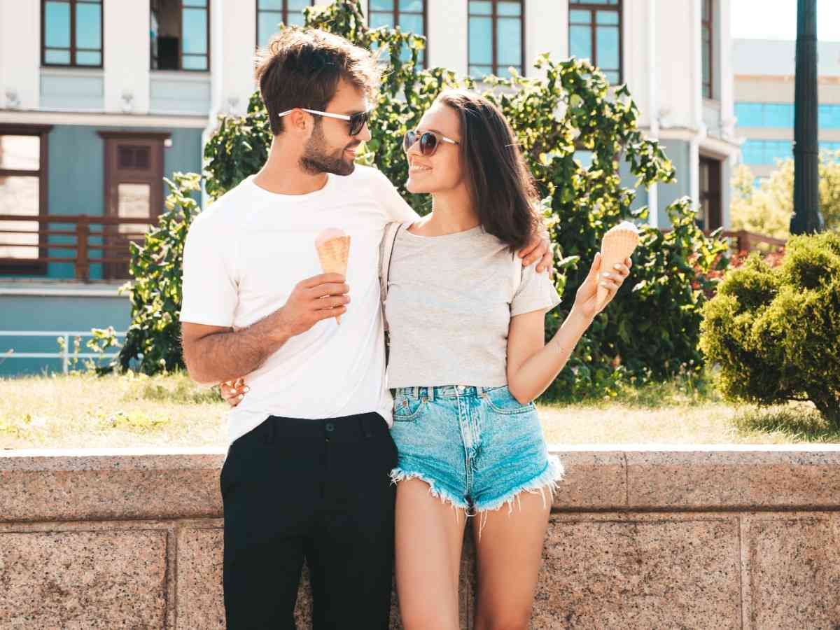 boy and girl looking at each other holding ice cream