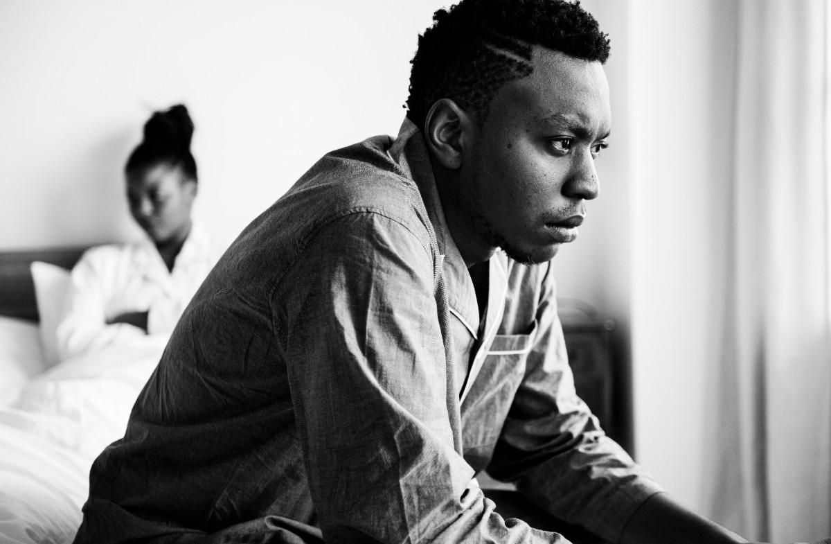 couple sadly looking opposite to each other