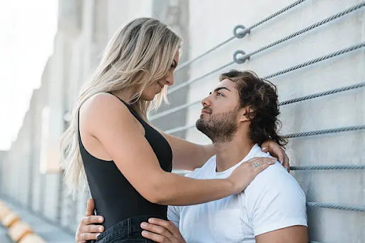 boy holding a girl n his arms