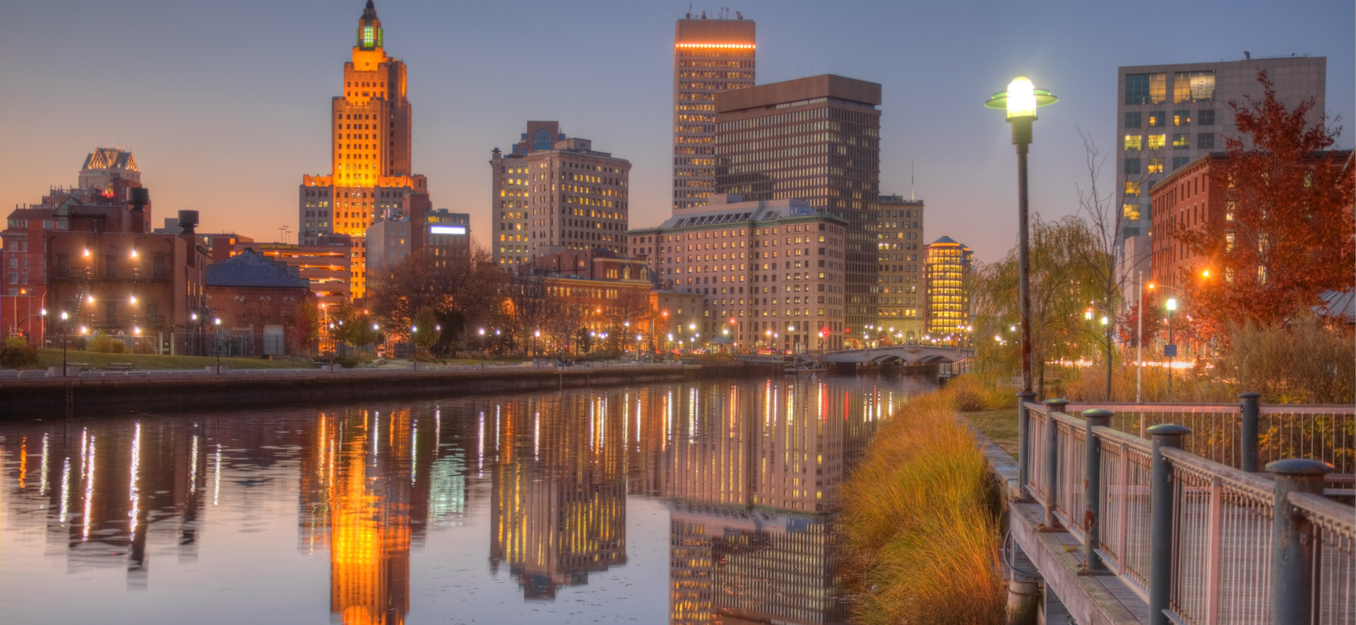 Providence RI at sunset reflections on river cityscape