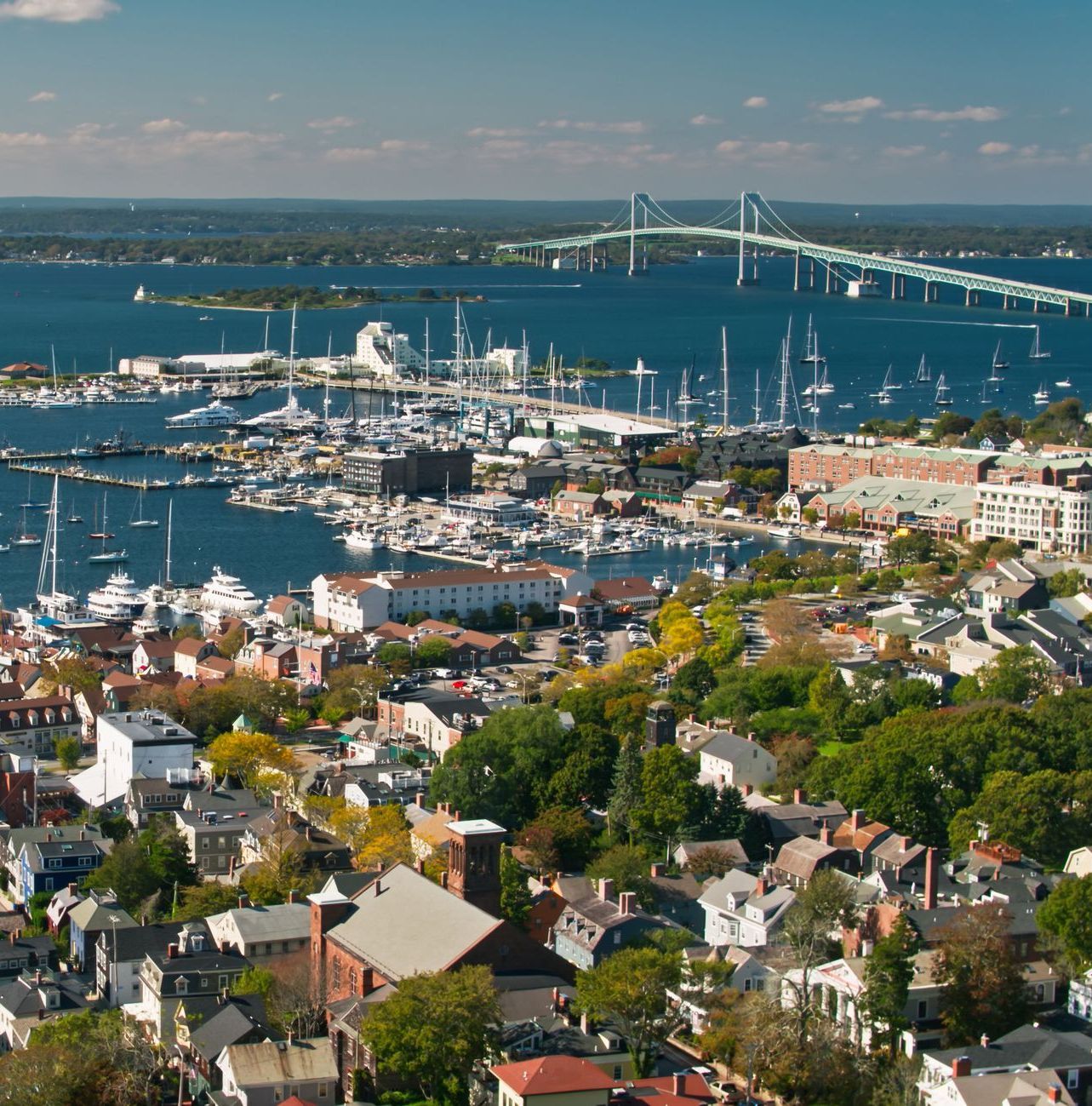 an aerial view of a city with boats in the water in Newport RI