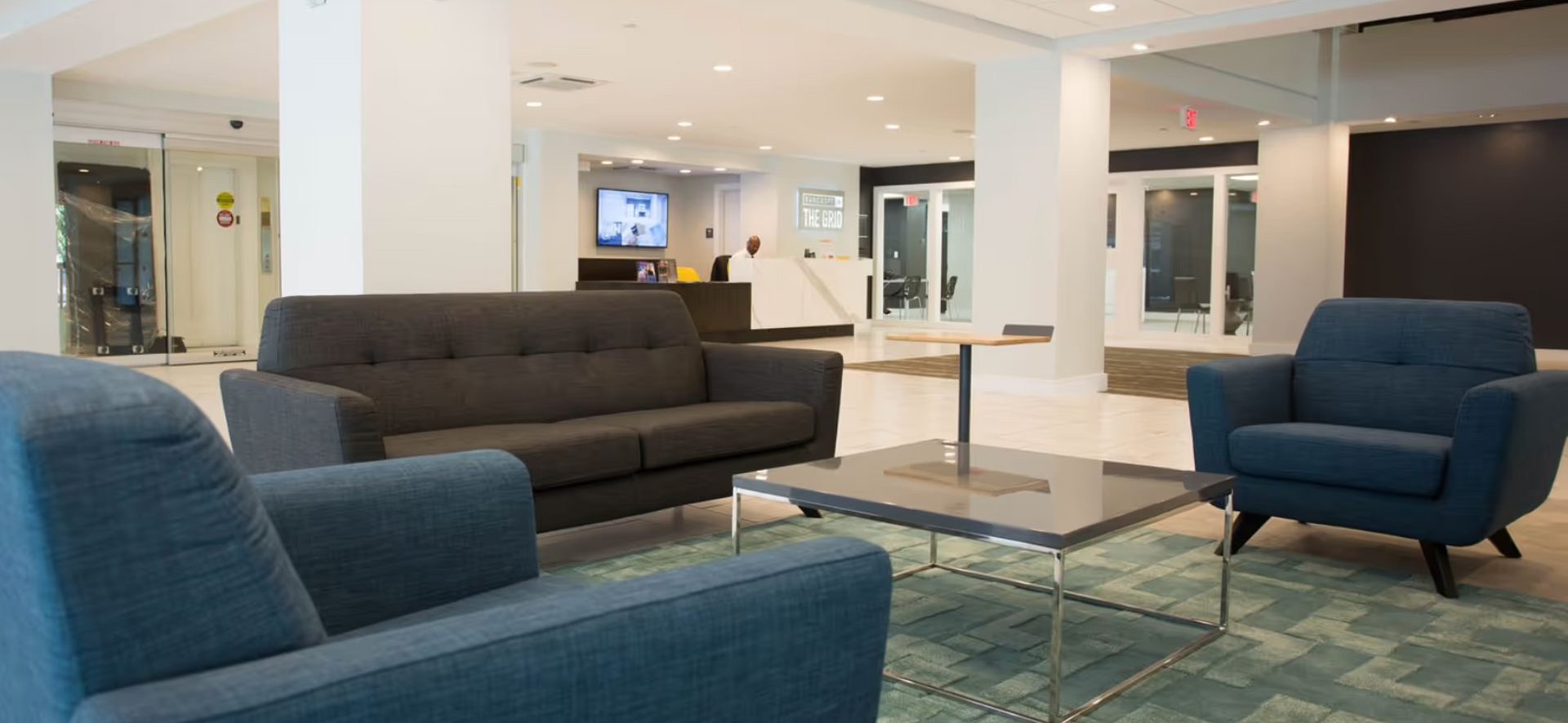 common area lounge couches off-campus student housing apartment