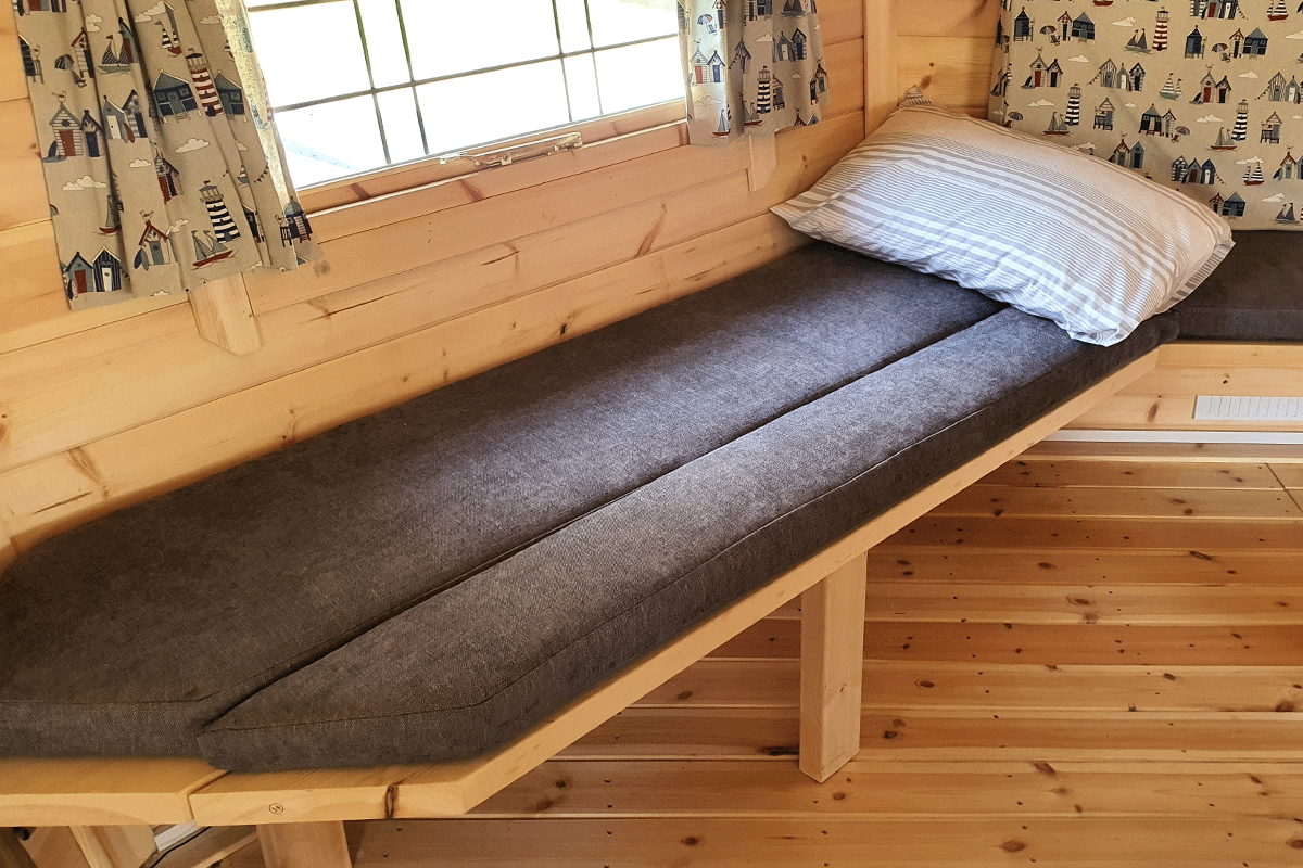 interior of BBQ hut with lift up sleeping platform
