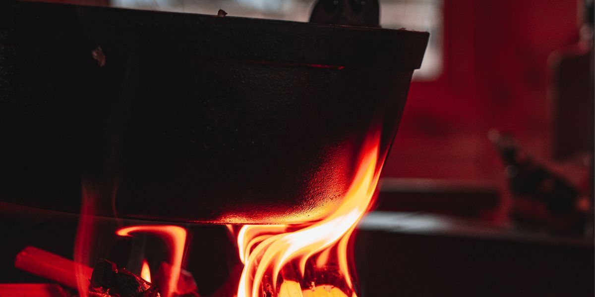 cast iron pan on barbecue lodge fire