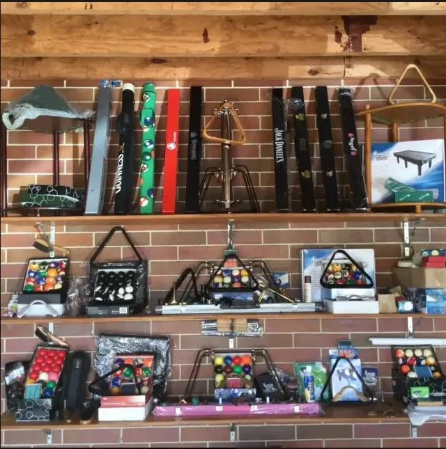 Billiard Balls And Accessories On The Shelves — Eight Ball Services In Taranganba, QLD