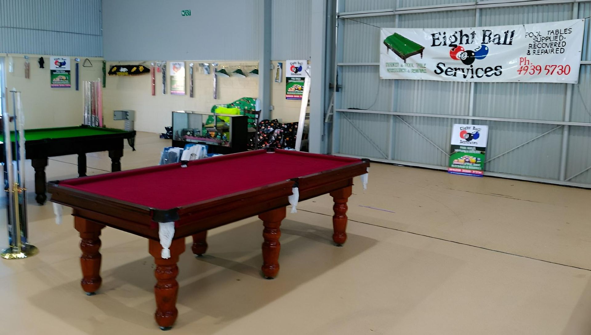 Red And Green Pool Tables Inside The Store — Eight Ball Services In Taranganba, QLD