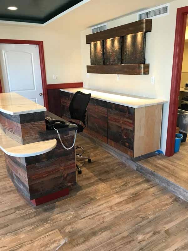 There is a desk and a chair in the room.