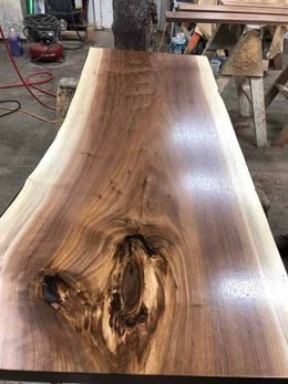 A large piece of wood is sitting on top of a table.