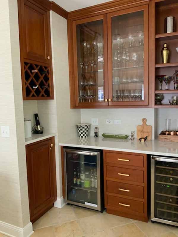 A kitchen with wooden cabinets and stainless steel appliances