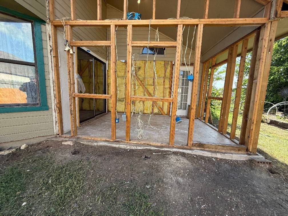 A house is being remodeled and a porch is being built.