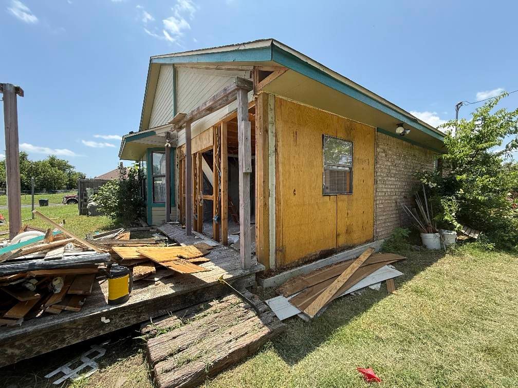 A house is being remodeled in the backyard.