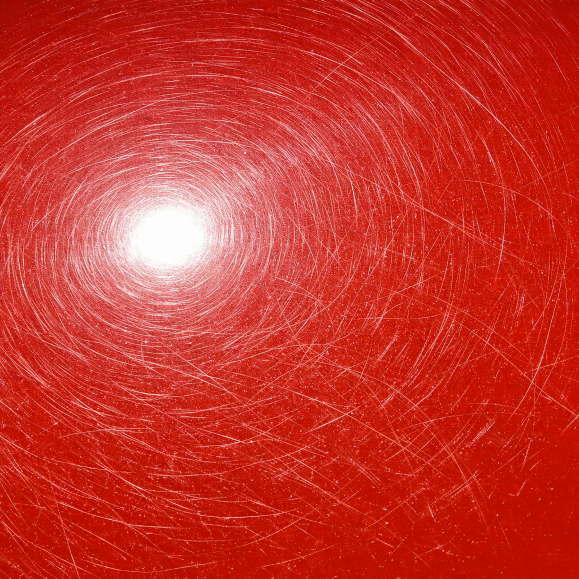 Red car roof being painted black; yellow tape used to mask the area.