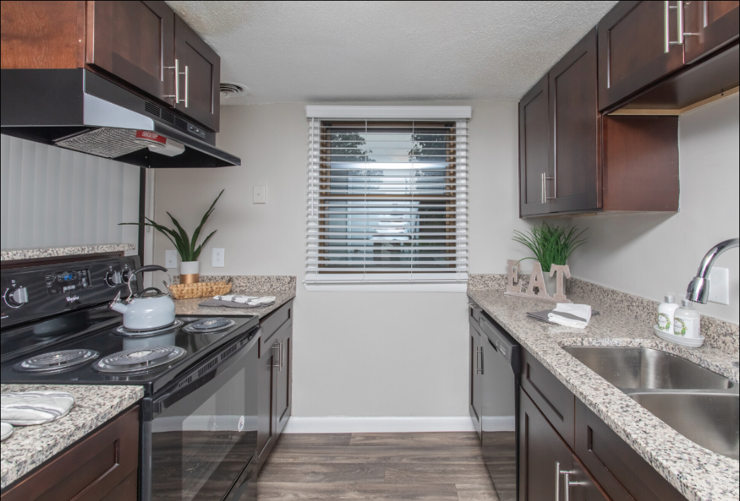 a kitchen with stainless steel appliances and granite counter tops