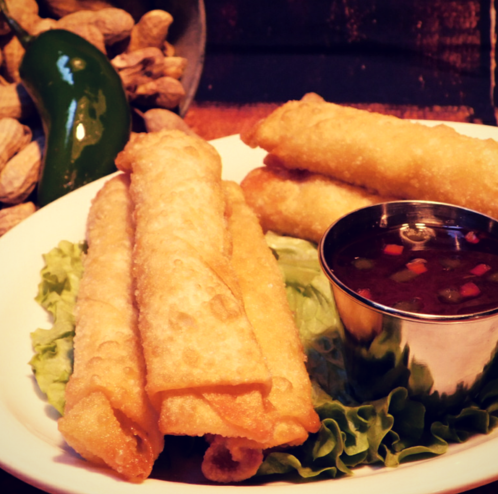 A plate of food with a bowl of dipping sauce