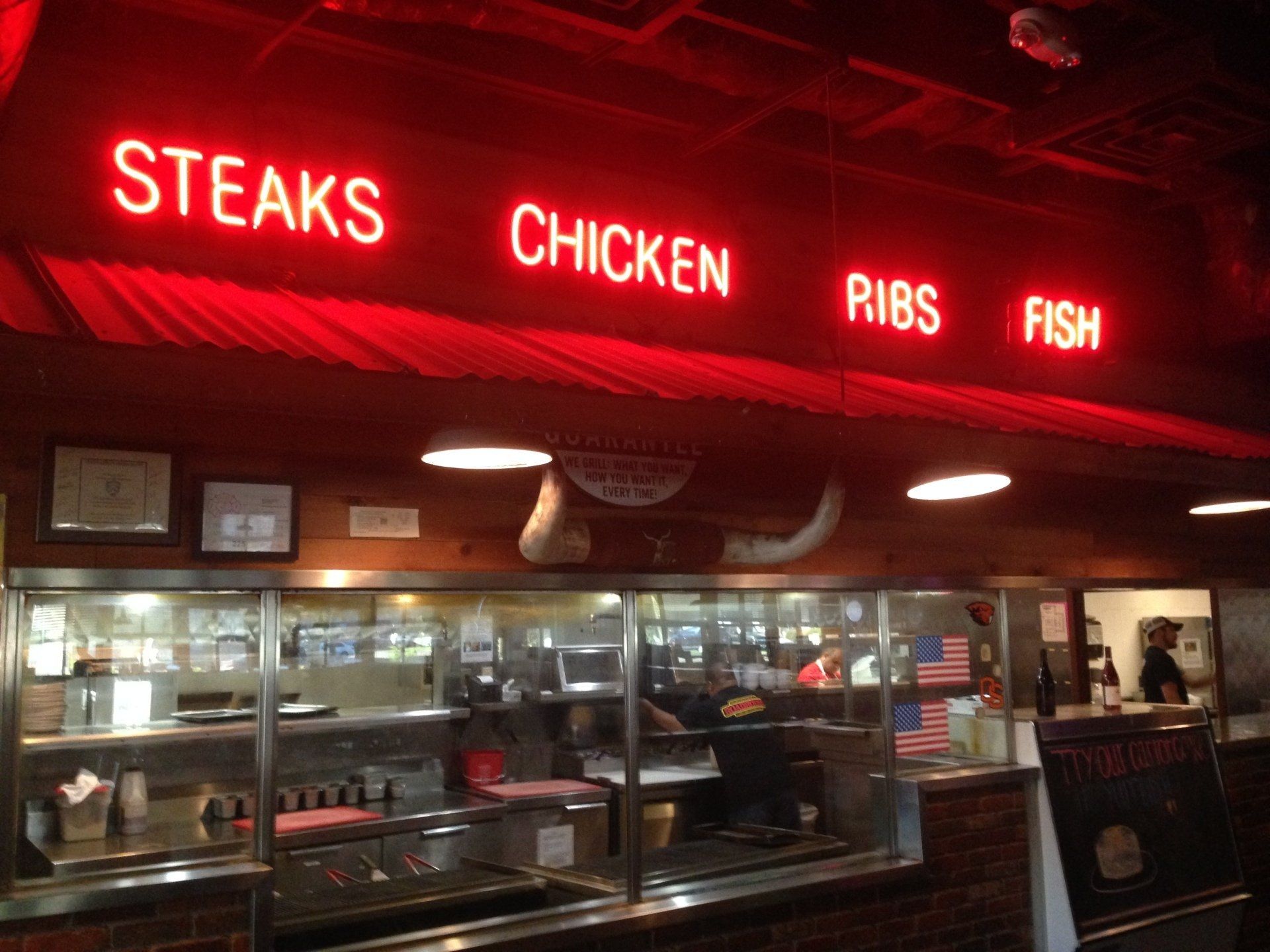 A restaurant that serves steaks chicken ribs and fish
