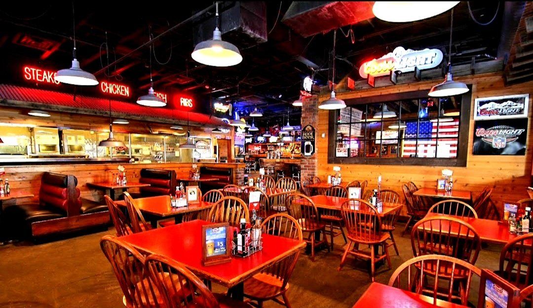 A restaurant with a lot of tables and chairs